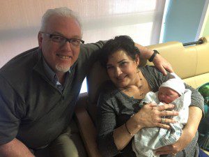 My parents and Lyra on the day she was born