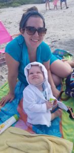 happy mom and baby on a beach