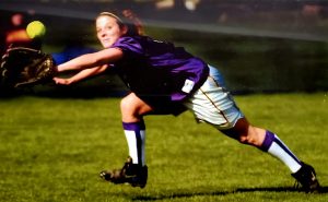 Diving for a softball is a lesson of college sports - you fall and get back up.