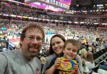 A man, women, and child inside Gainbridge Fieldhouse for Fever Game Day